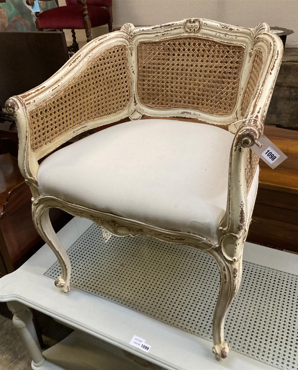 A Louis XVI style painted caned tub framed chair, width 62cm, depth 50cm, height 80cm
